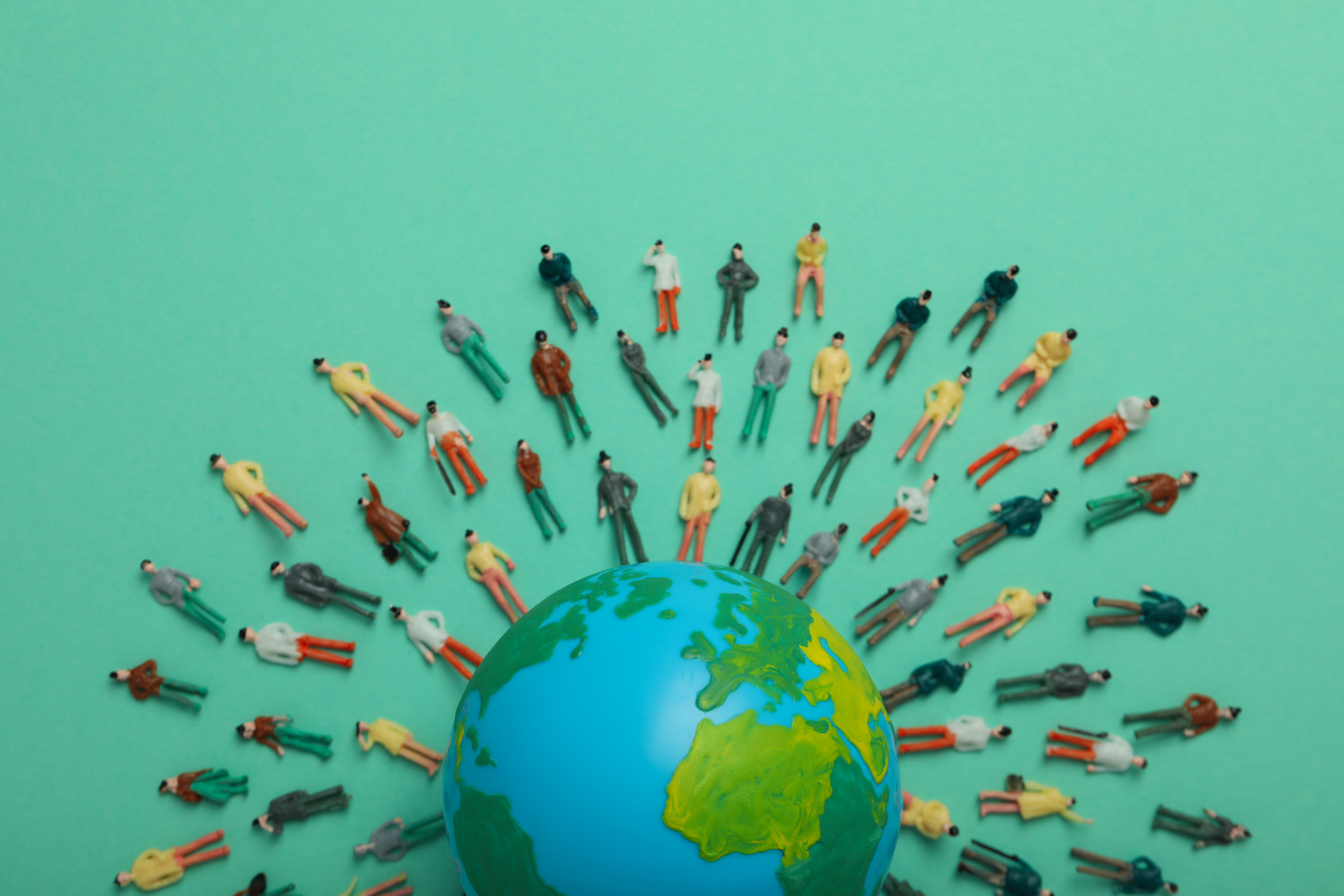 concept-of-population-with-globe-and-toy-people-2025-03-26-23-59-05-utc
